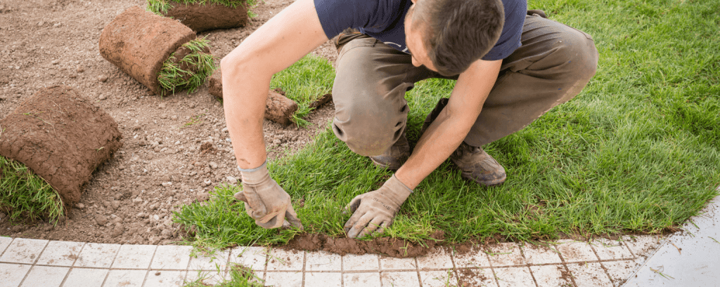 Landscaper works on walkway